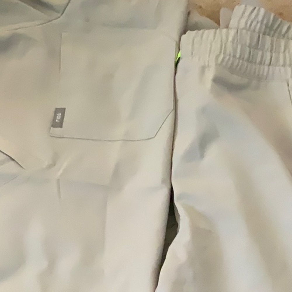 Figs jogger scrub set in a cement color. Joggers a med and shirt a large